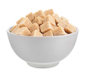 Photo of Brown sugar cubes in bowl isolated on white