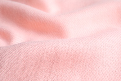 Photo of Pink knitted sweater as background, closeup view