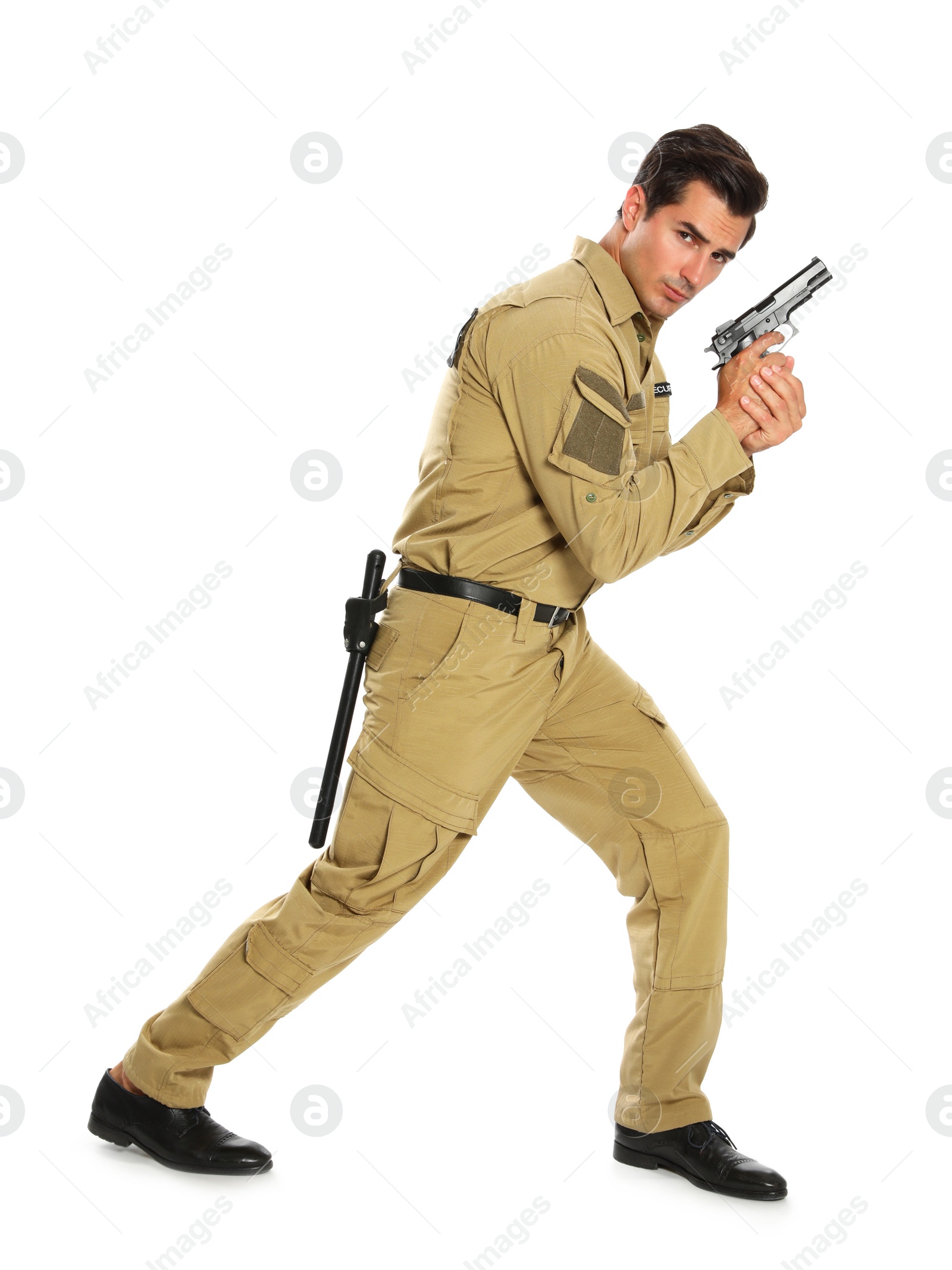 Photo of Male security guard in uniform with gun on white background