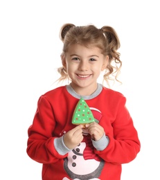 Cute little girl with Christmas gingerbread cookie on white background