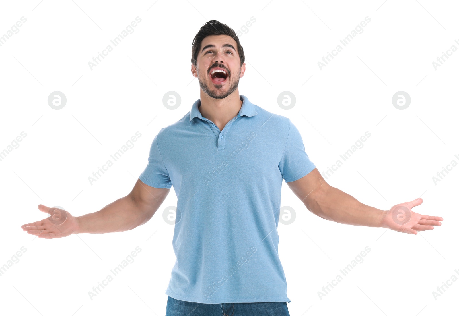 Photo of Happy young man with hands up on white background