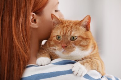 Photo of Woman with her cute cat, closeup view