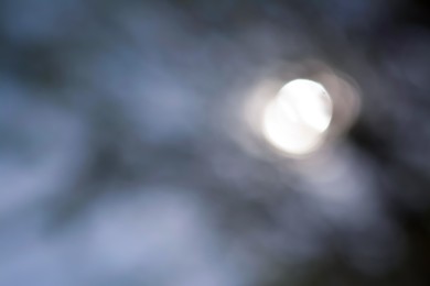 Photo of Abstract blurred background with sun glares. Bokeh effect
