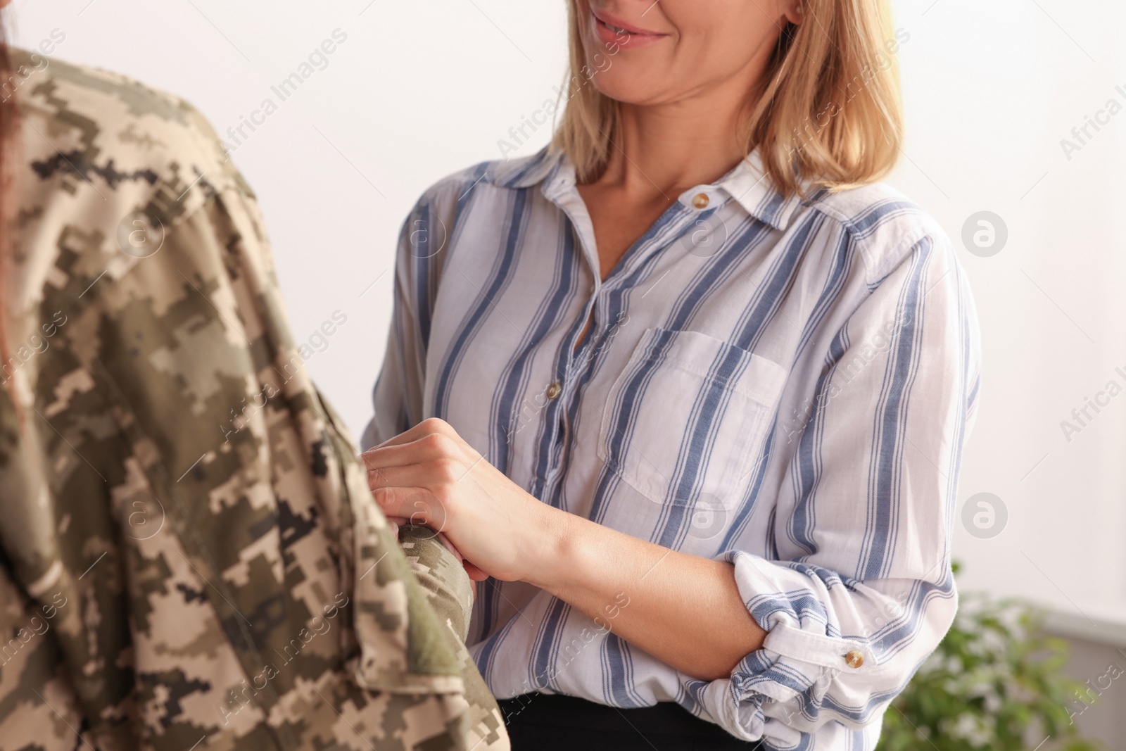 Photo of Psychologist supporting military officer in office, closeup