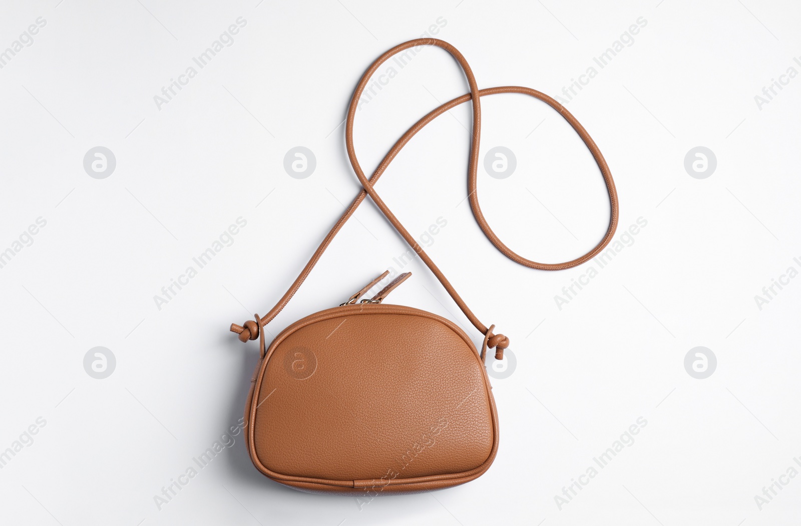 Photo of Stylish leather handbag on white background, top view