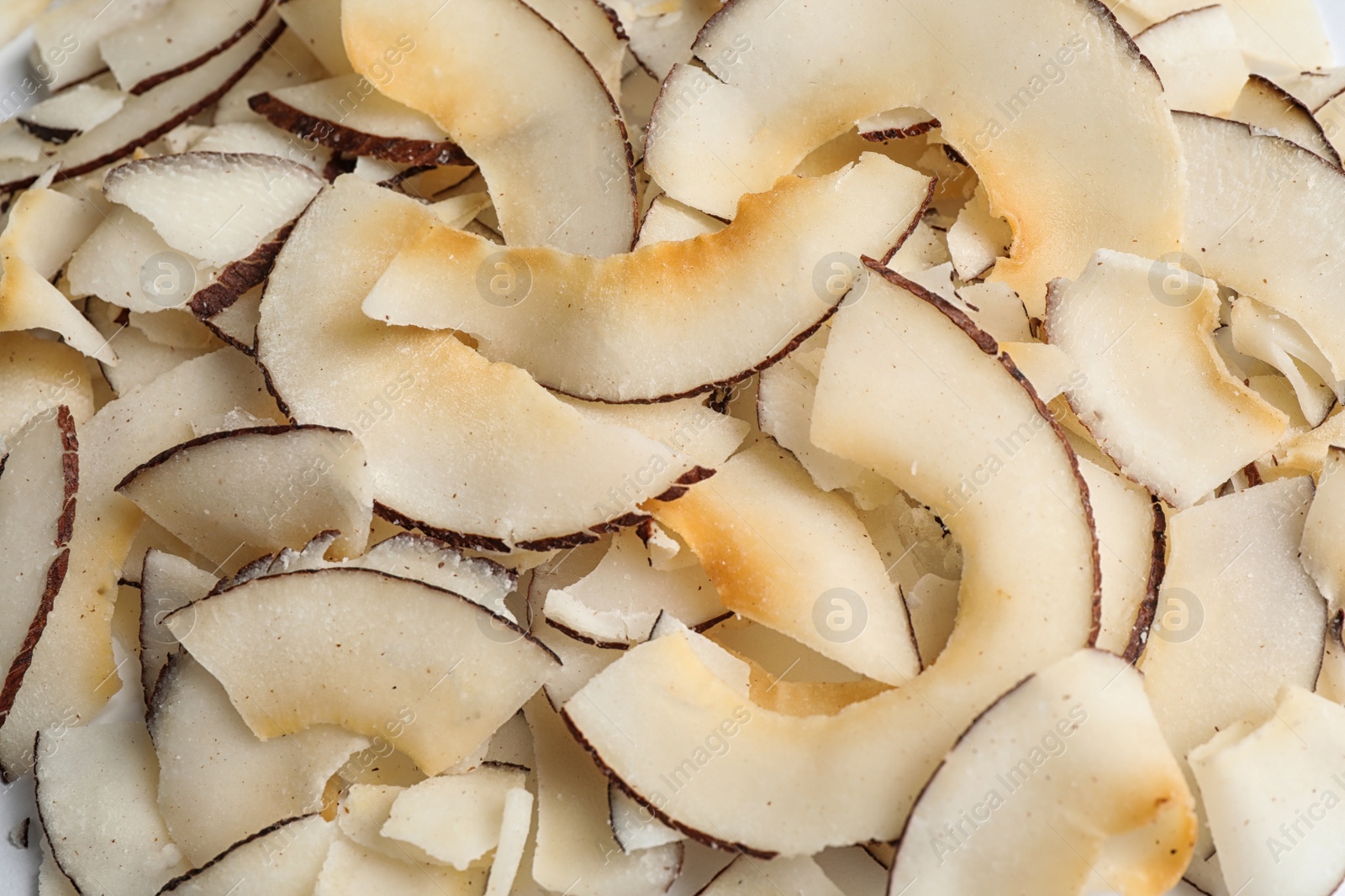 Photo of Delicious fresh coconut chips as background, closeup