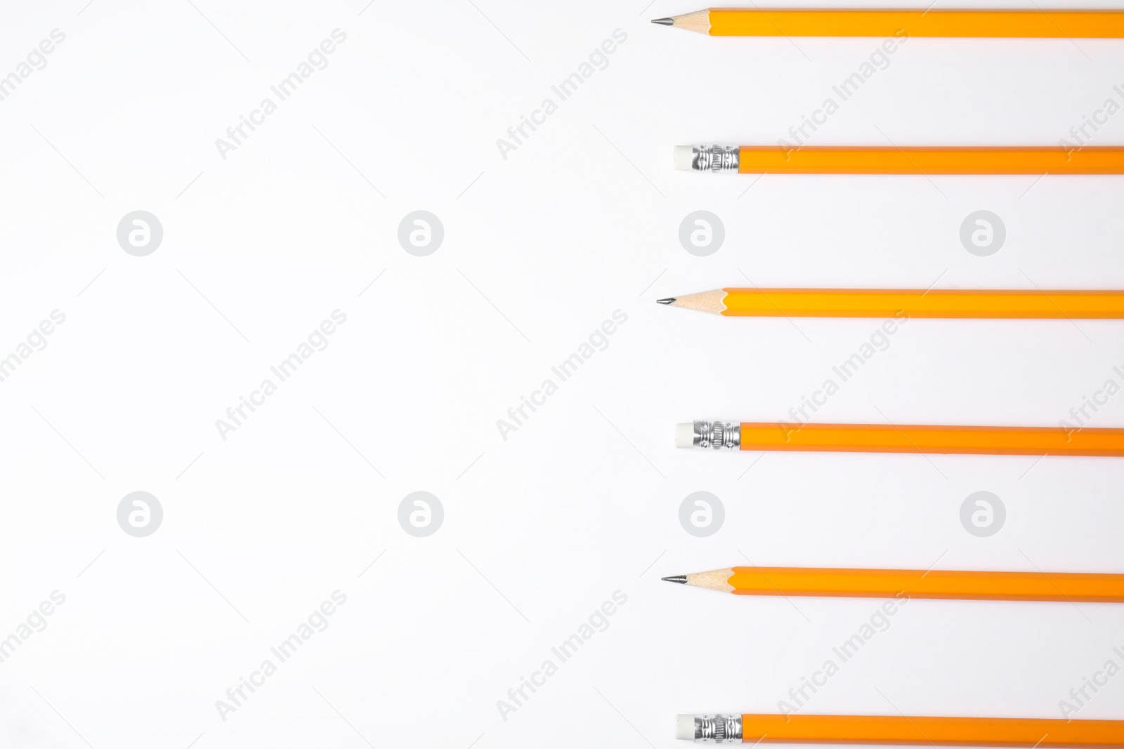 Photo of Graphite pencils on white background, top view