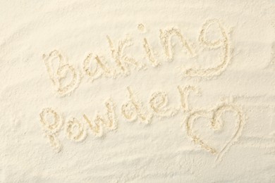 Photo of Words Baking Powder and heart written on powder, top view