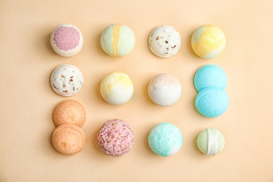 Photo of Flat lay composition with bath bombs on color background