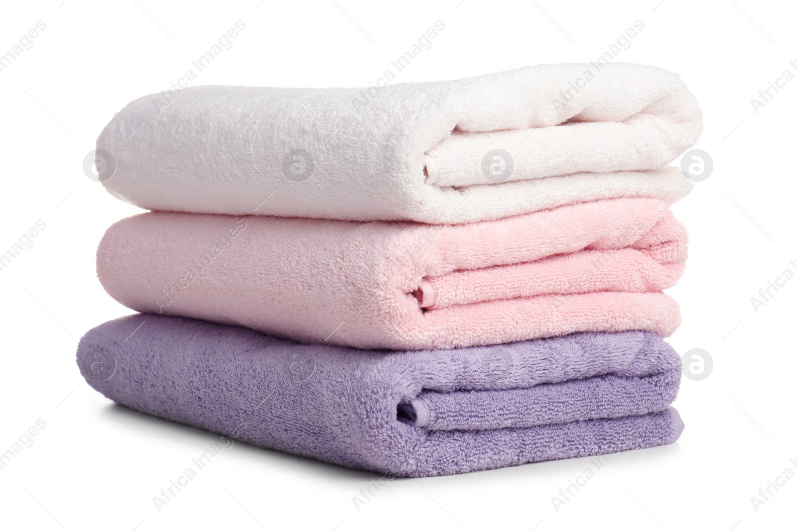 Photo of Folded soft terry towels on white background