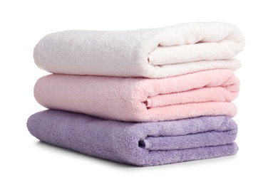 Photo of Folded soft terry towels on white background