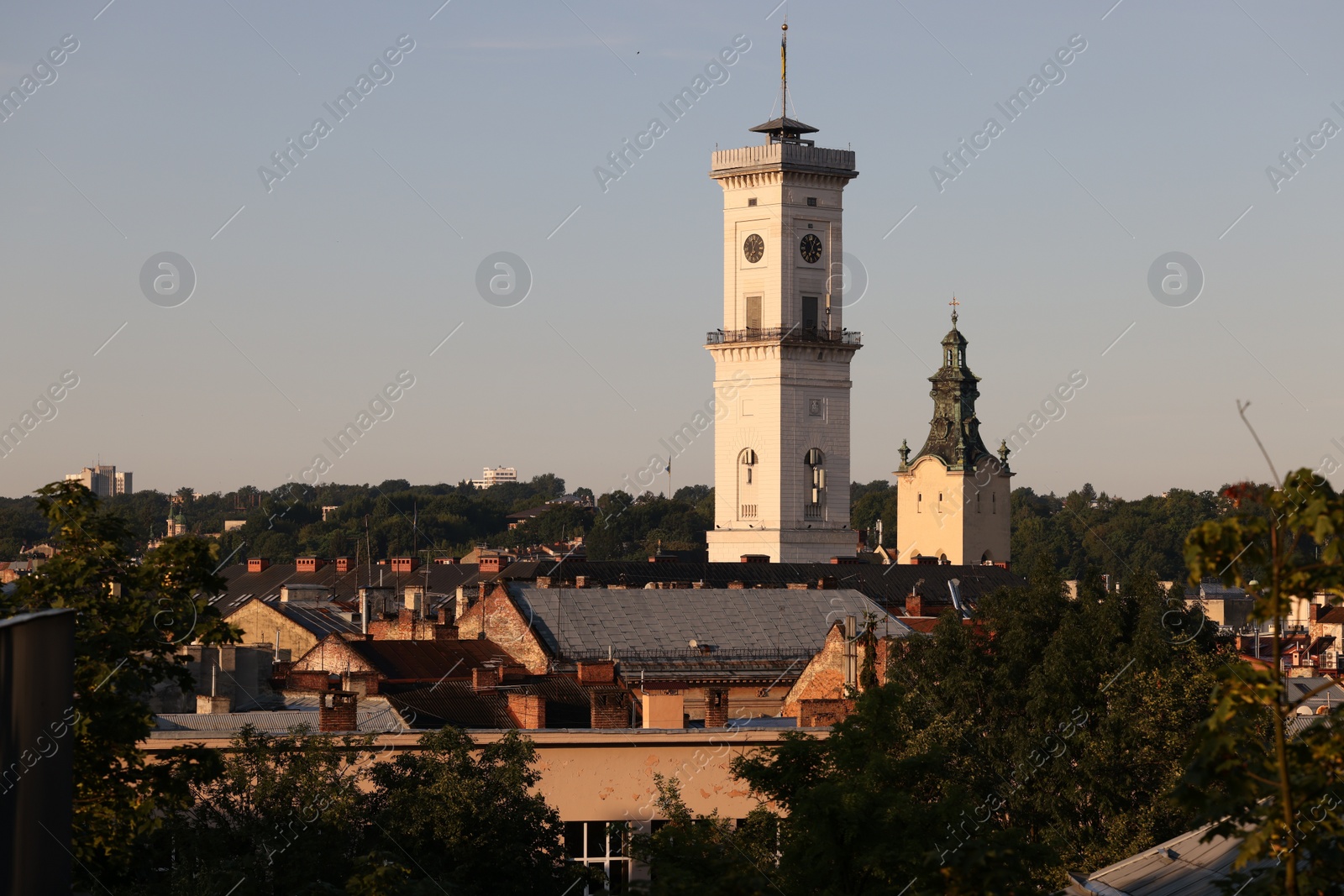 Photo of Picturesque view of city with beautiful tower and buildings on summer day