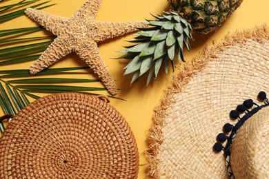 Flat lay composition with beach accessories on color background