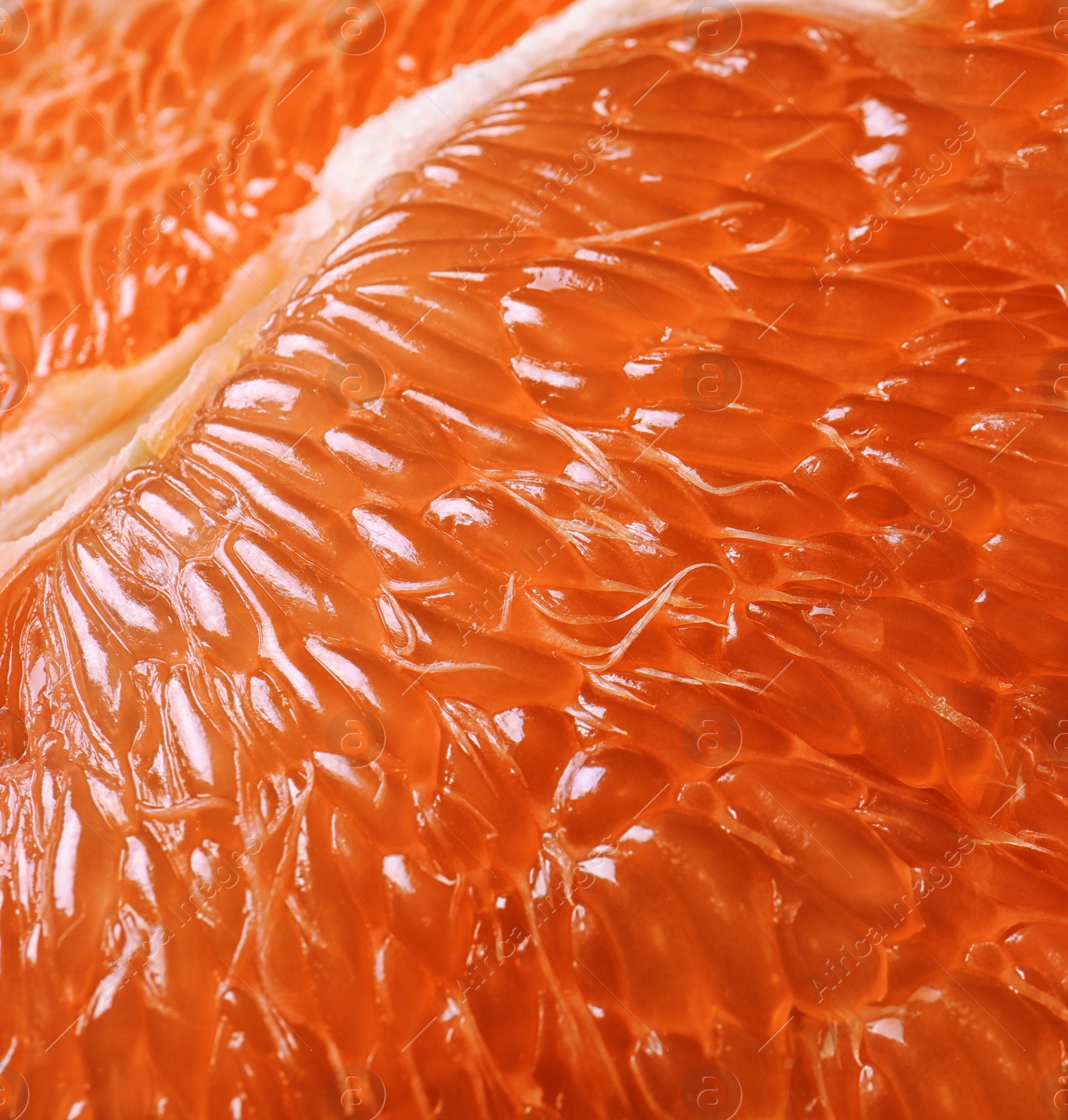 Photo of Peeled ripe grapefruit as background, closeup. Orange citrus fruit