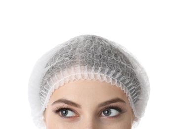 Photo of Young medical student in surgical cap on white background, closeup