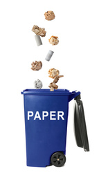 Image of Different paper garbage falling into trash bin. Waste management and recycling