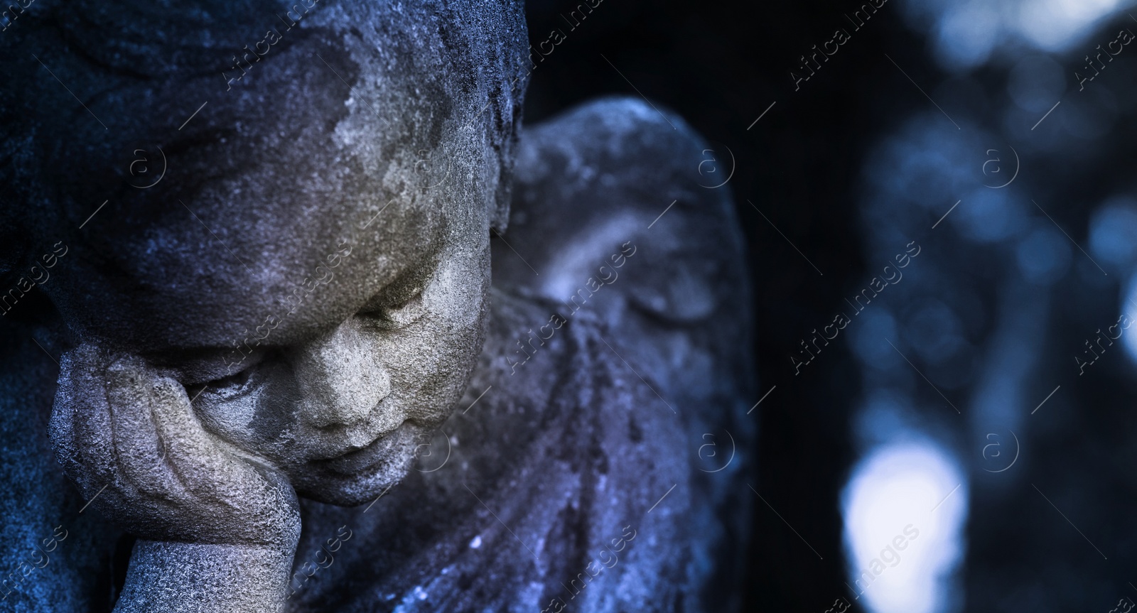 Image of Beautiful statue of angel at cemetery, closeup view. Space for text