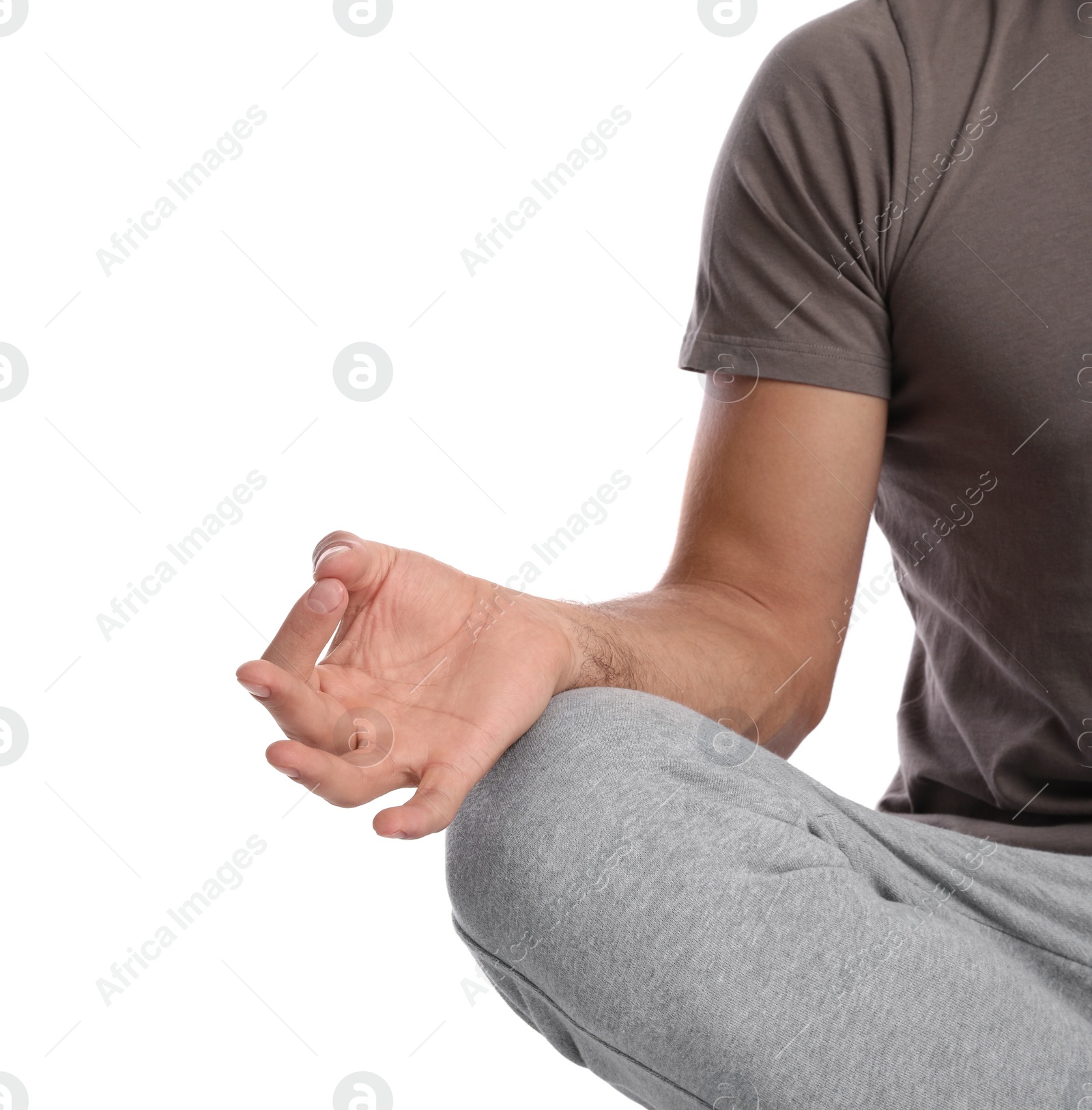 Photo of Man meditating on white background, closeup. Harmony and zen