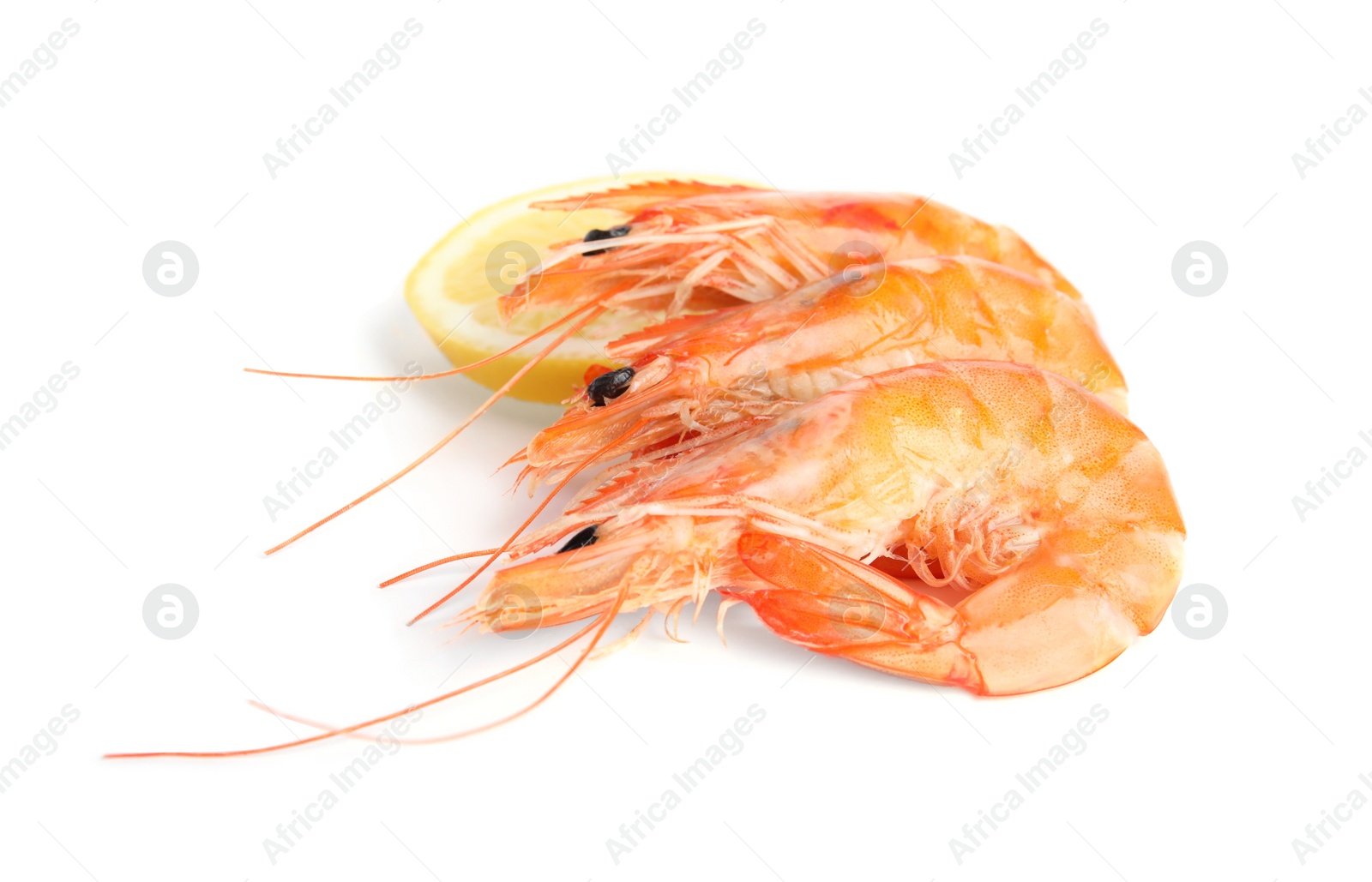 Photo of Delicious cooked shrimps and lemon isolated on white