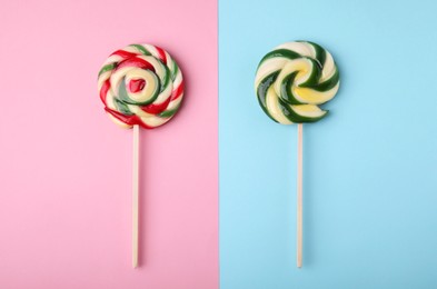 Sweet lollipops on color background, flat lay