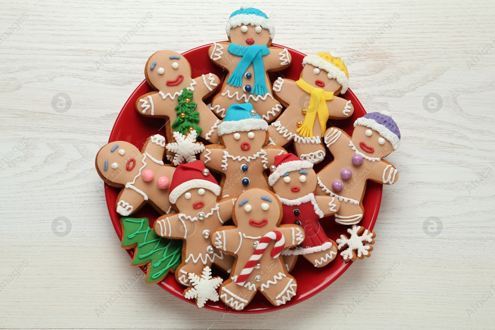 Photo of Delicious Christmas cookies on white wooden table, top view