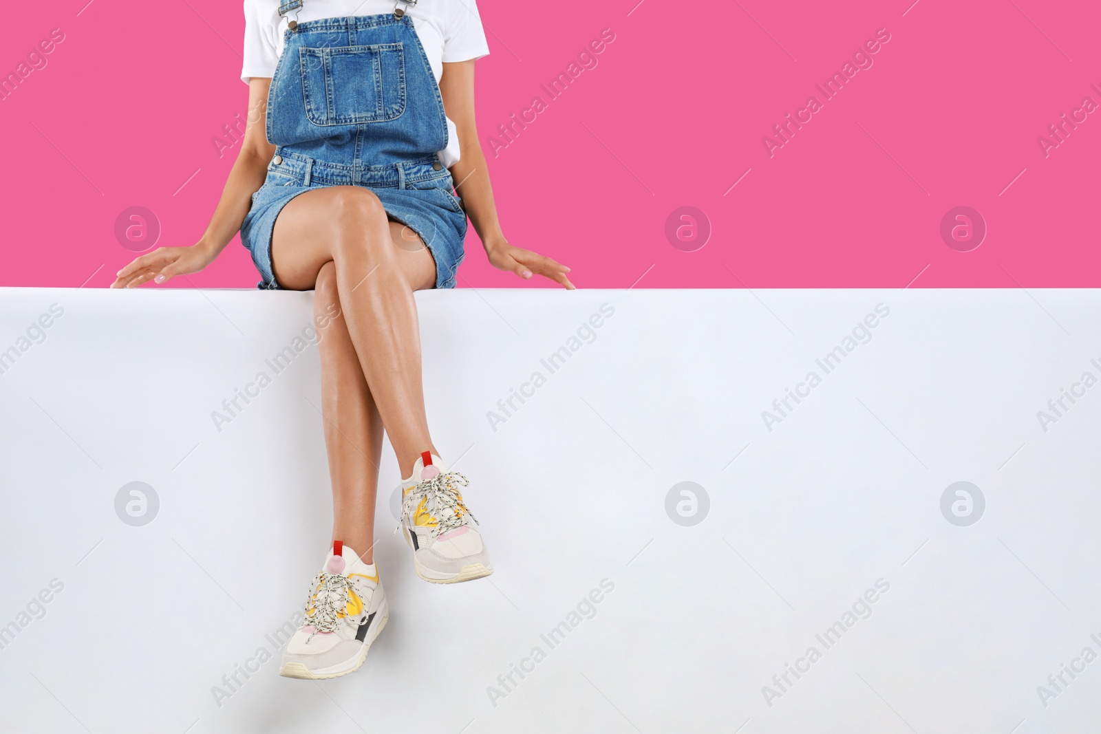 Photo of Woman wearing stylish shoes on color background, closeup