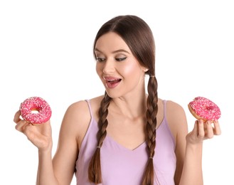 Photo of Beautiful young woman with donuts on white background