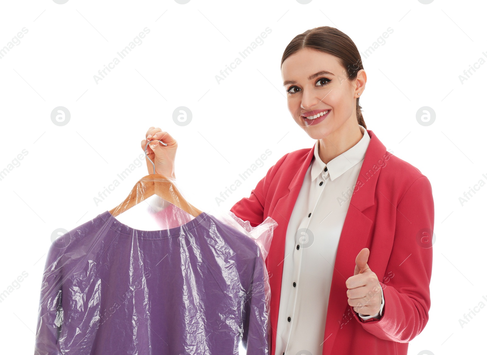 Photo of Young woman holding hanger with sweatshirt on white background. Dry-cleaning service