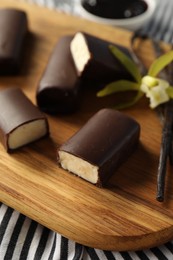 Photo of Glazed vanilla curd cheese bars on table, closeup