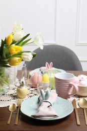 Photo of Festive table setting with beautiful flowers. Easter celebration