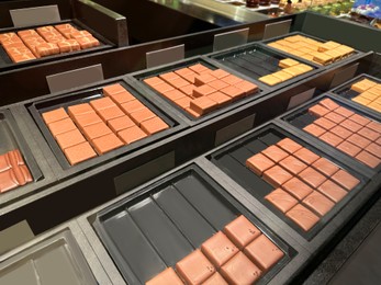 Photo of Showcase with different delicious desserts in store