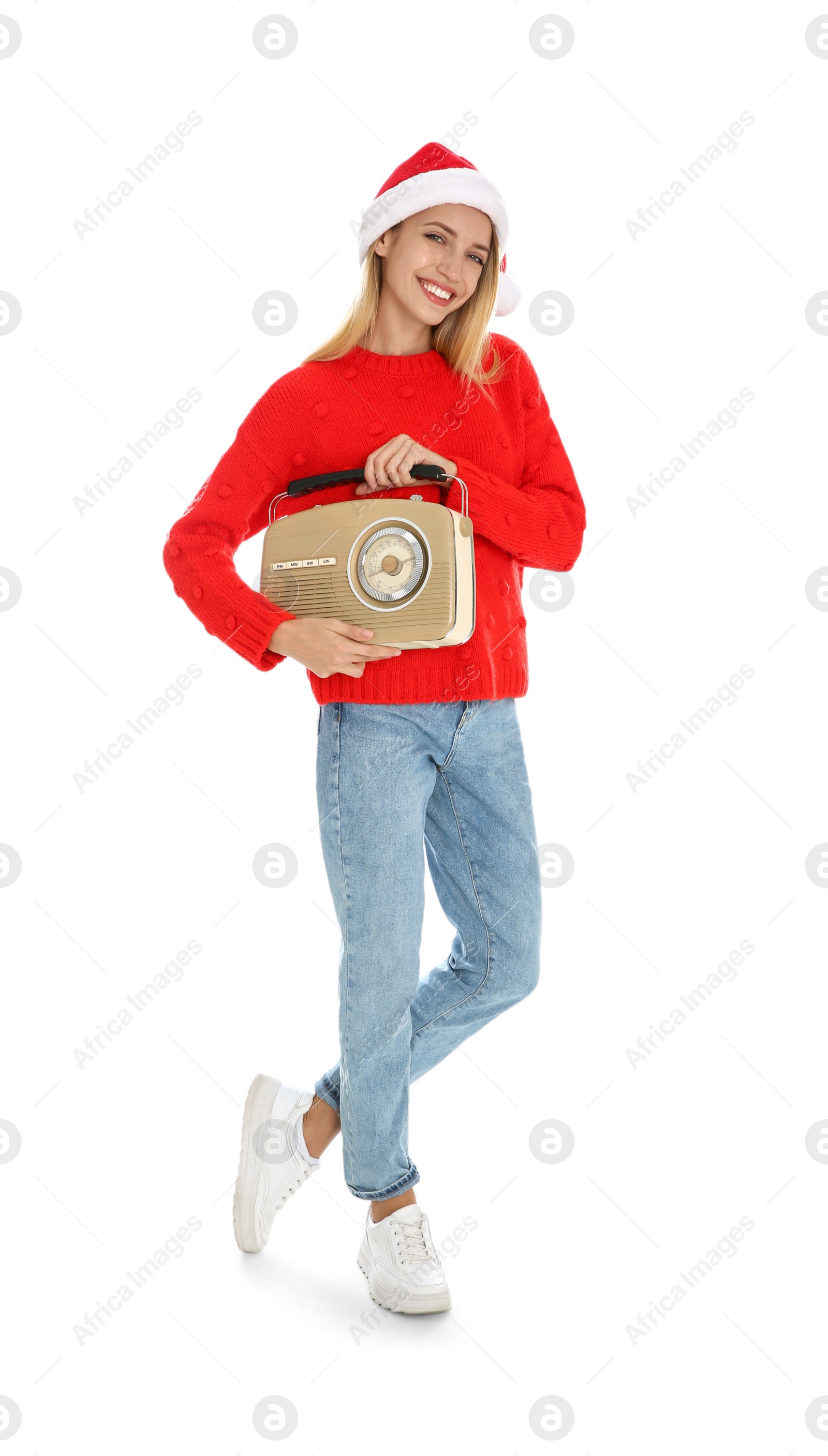 Photo of Happy woman with vintage radio on white background. Christmas music