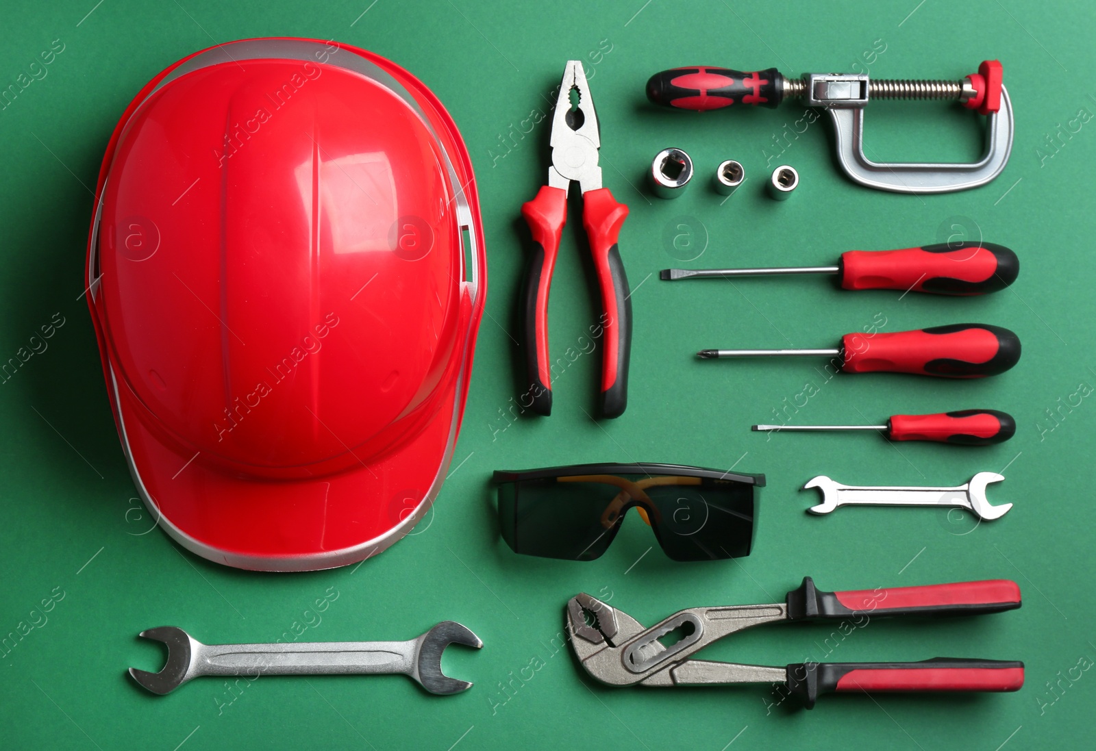 Photo of Flat lay composition with different construction tools on color background