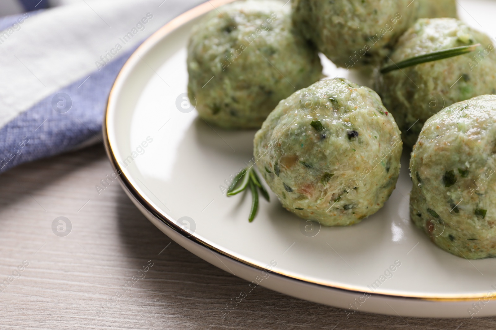 Photo of Tasty falafel balls on white wooden table, closeup. Vegan products