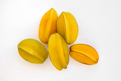 Photo of Delicious ripe carambolas on white background, top view