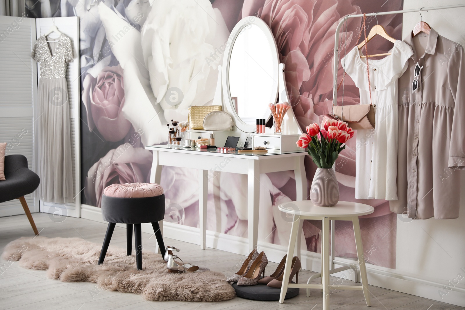 Photo of Stylish room interior with elegant dressing table and floral wallpaper