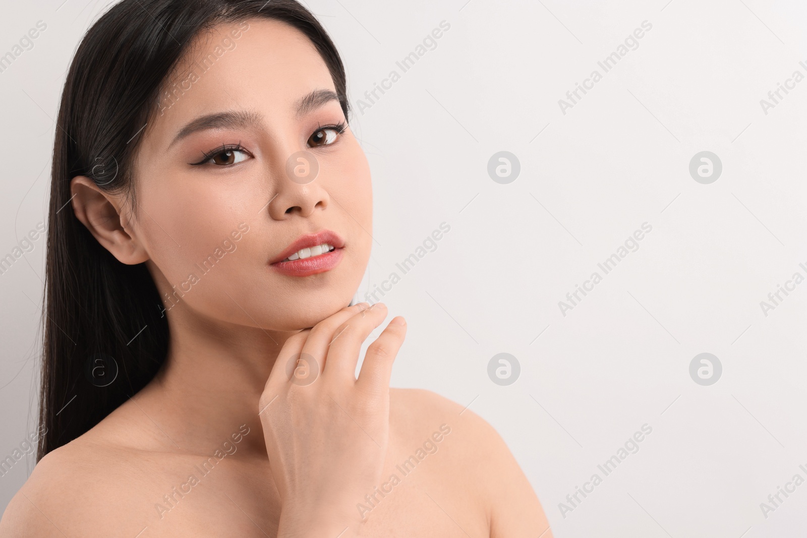 Photo of Portrait of beautiful woman on white background