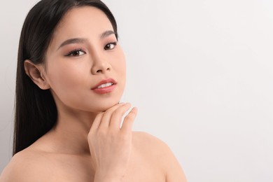 Portrait of beautiful woman on white background