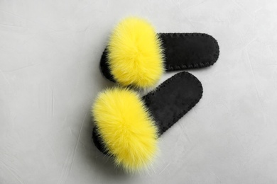 Photo of Pair of soft slippers on light grey background, flat lay