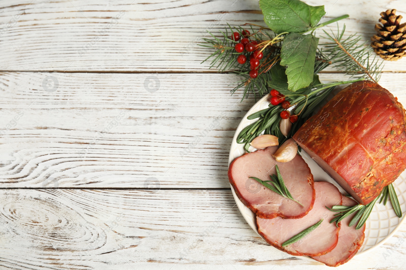 Photo of Flat lay composition with delicious ham on white wooden table, space for text. Christmas dinner