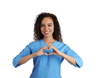 Photo of Happy young African-American doctor making heart with hands on white background