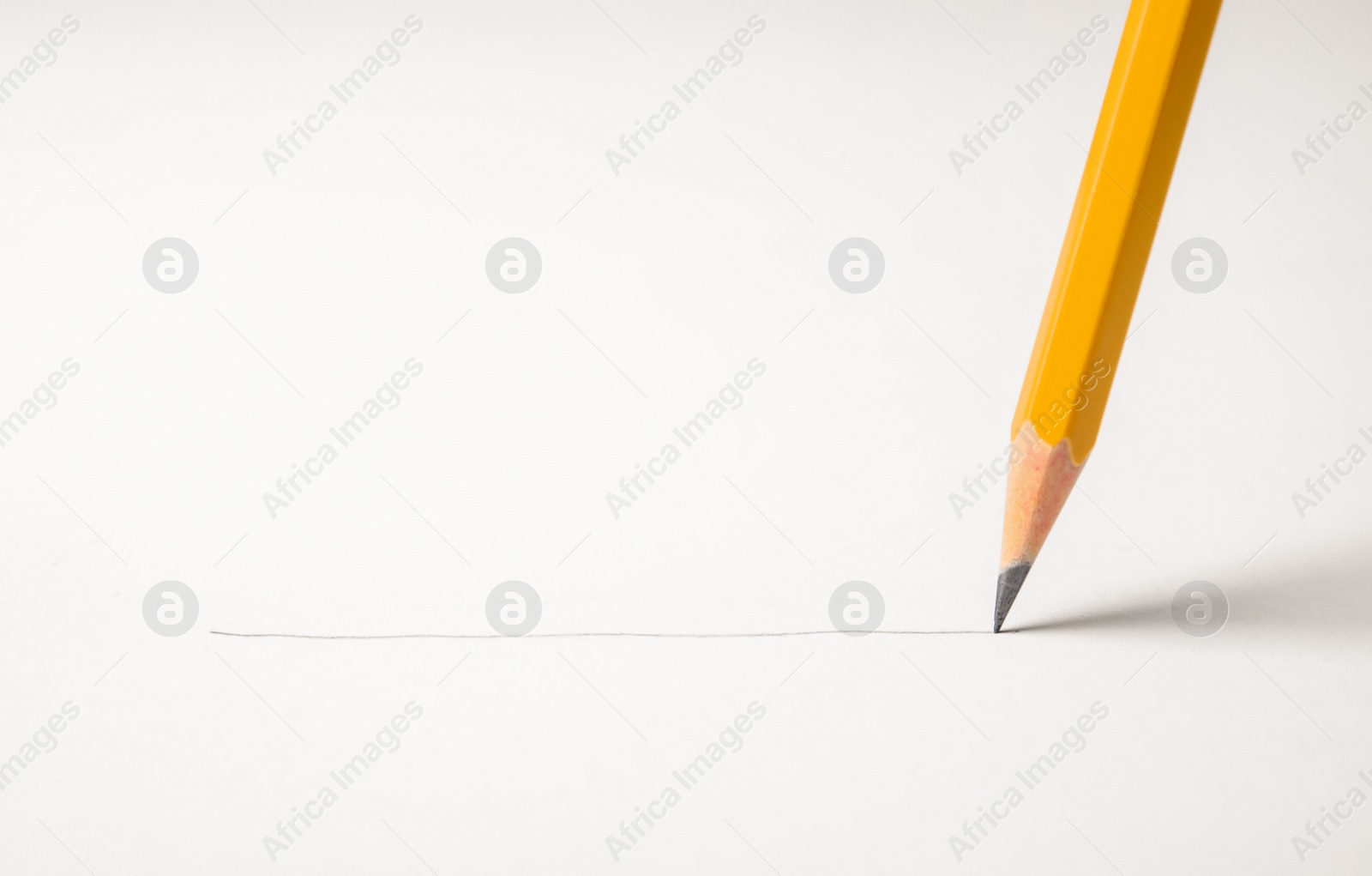 Photo of Sharp pencil drawing line on white paper