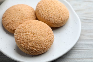 Delicious sugar cookies on white wooden table, closeup