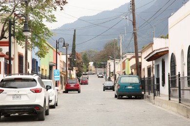 San Pedro Garza Garcia, Mexico – February 8, 2023: View on street with parked cars and beautiful buildings