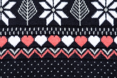 Photo of Texture of cozy warm sweater as background, closeup