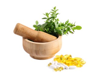 Photo of Mortar with fresh green mint and pills on white background