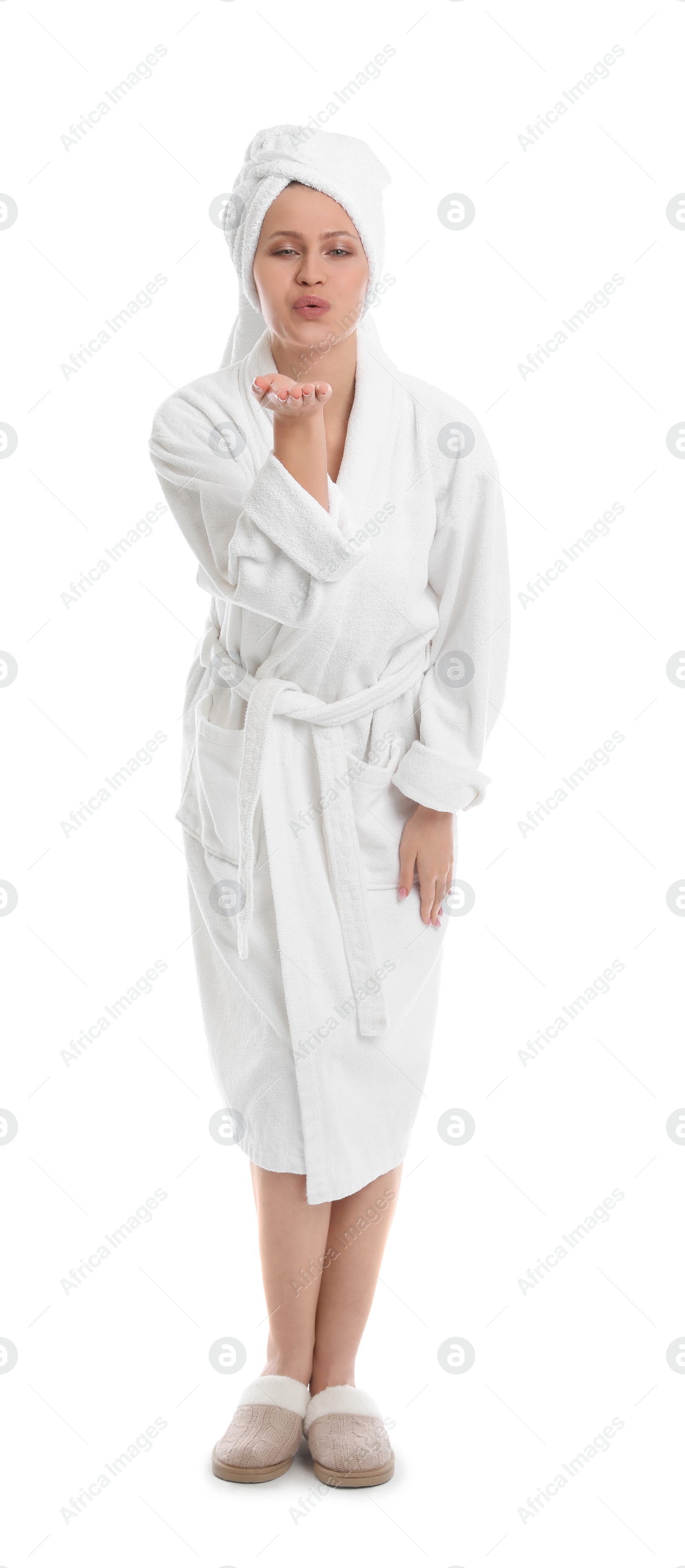 Photo of Young woman in bathrobe on white background