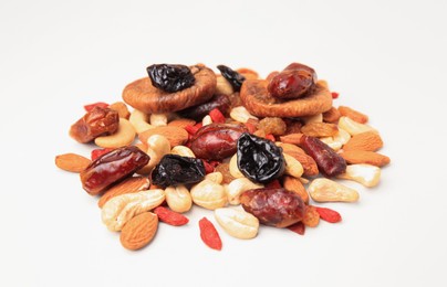 Photo of Pile of mixed dried fruits and nuts on white background, closeup