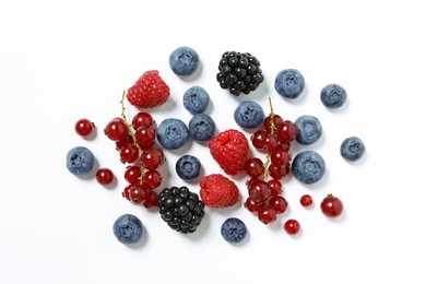 Many different fresh berries on white background, flat lay