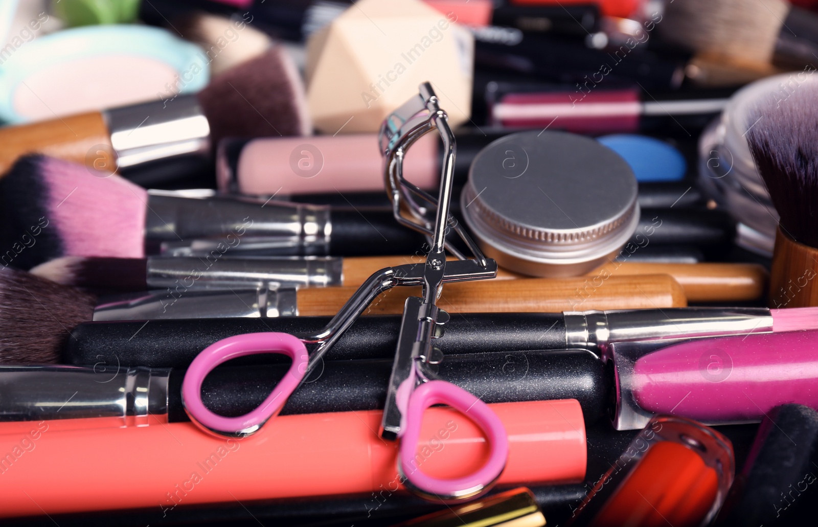 Photo of Set of different makeup products and tools as background, closeup